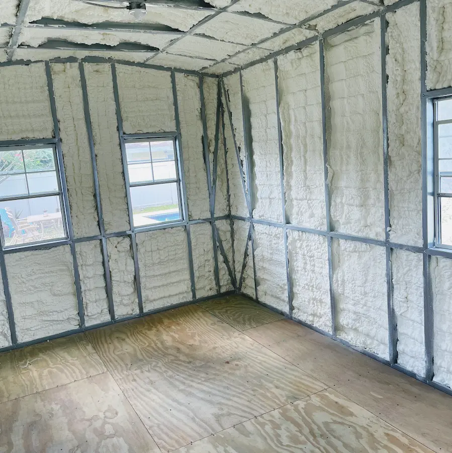 Closed-cell spray foam insulation applied to wall cavities in a residential project in Waupaca